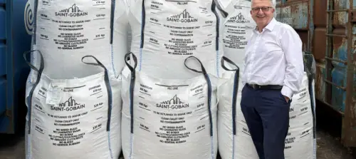 Ian Short of Morley Glass with bags of cullet produced from recycled post-consumer IGUs.